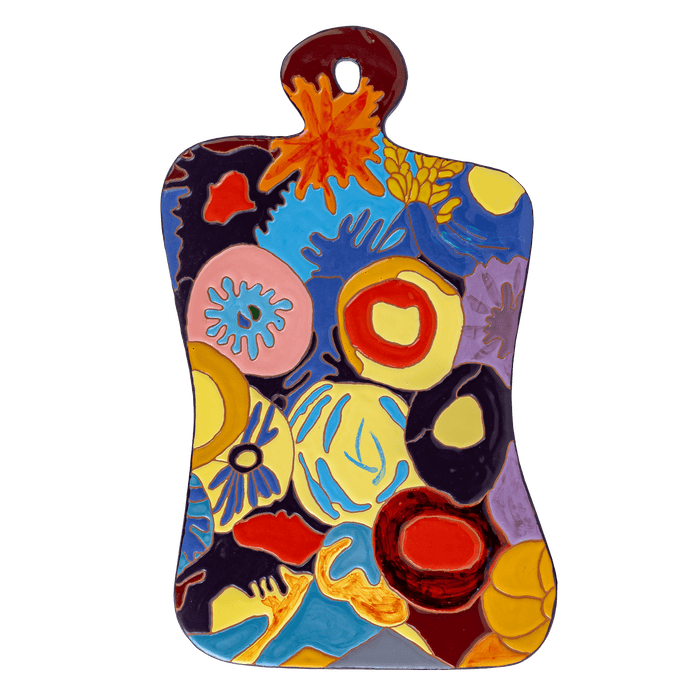 Versatile ceramic cheeseboard for serving, cutting, and as a heat-resistant stand.